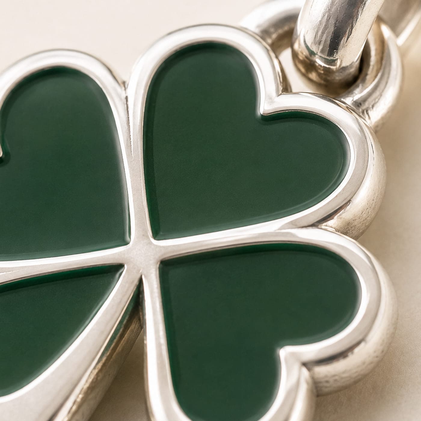 Close-up of the green enamel leaves set into the polished frame