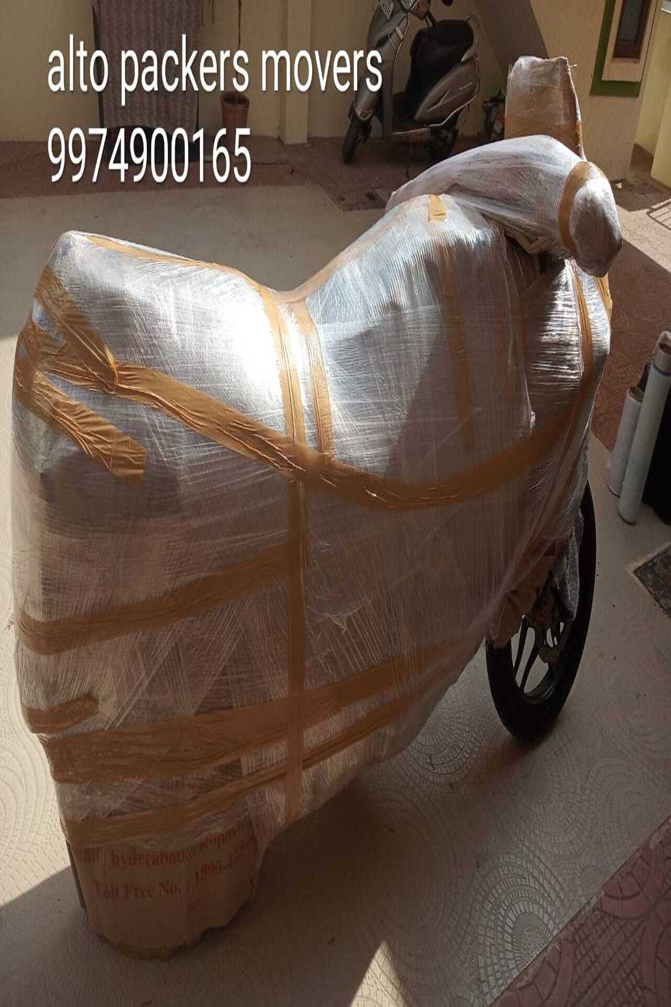 Motorcycle fully wrapped in stretch film ready for transport