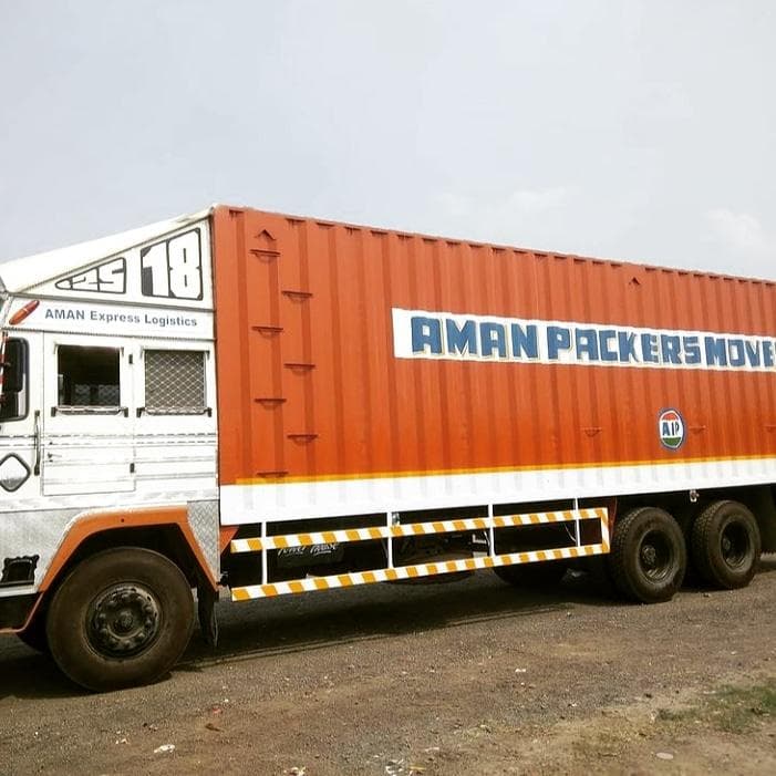 Aman Packers and Movers container truck in Surat