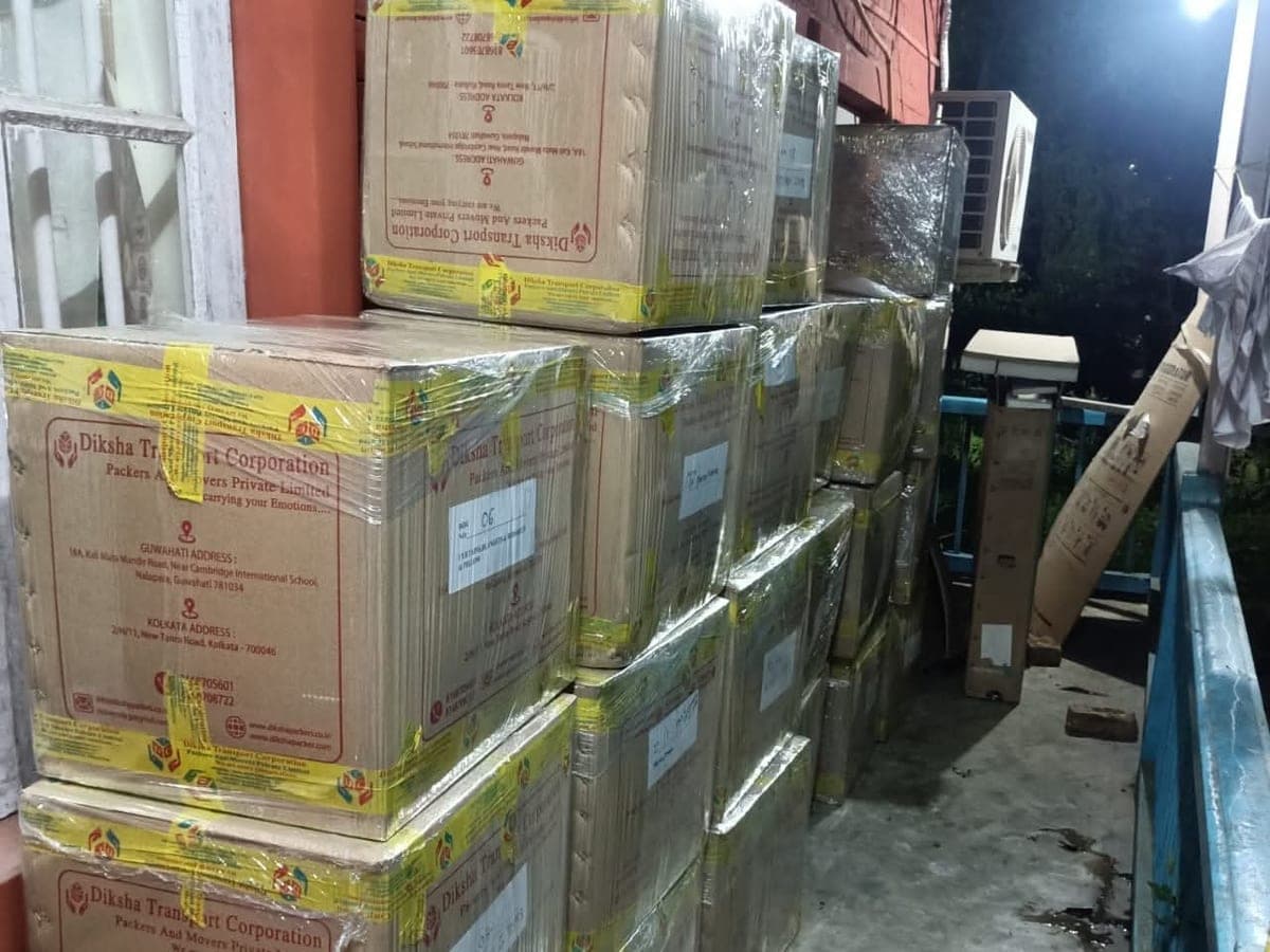 Stacked cartons wrapped in stretch film and branded tape, printed with the Diksha company name
