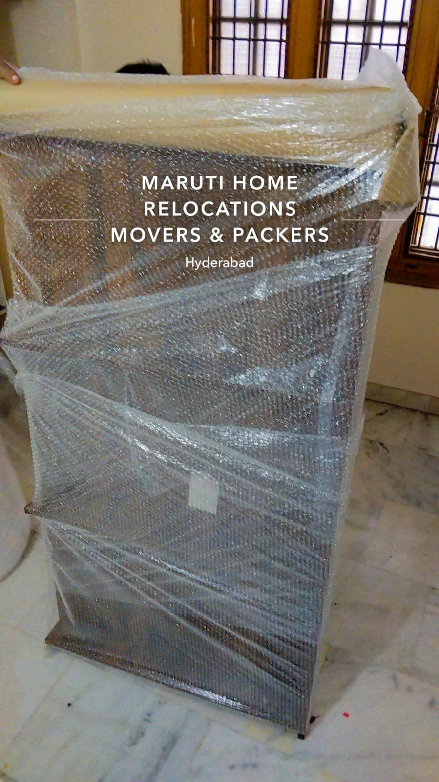 Wardrobe protected with corrugated sheet and stretch film