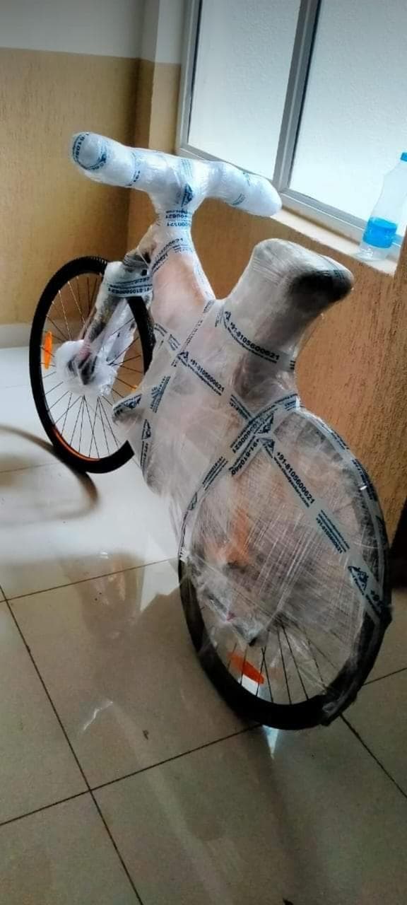 Bicycle wrapped in stretch film for safe transit