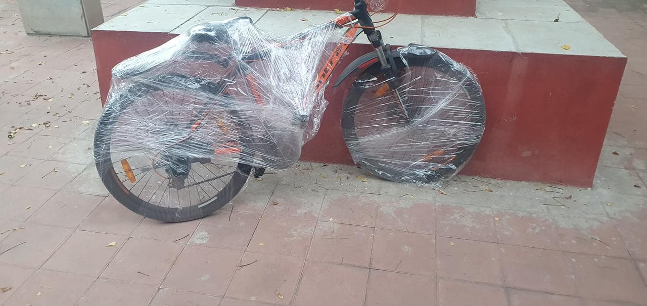 Mountain bicycle wrapped in stretch film outdoors