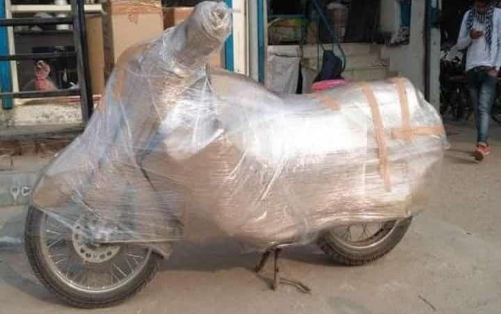 Motorcycle fully wrapped in protective film on the street