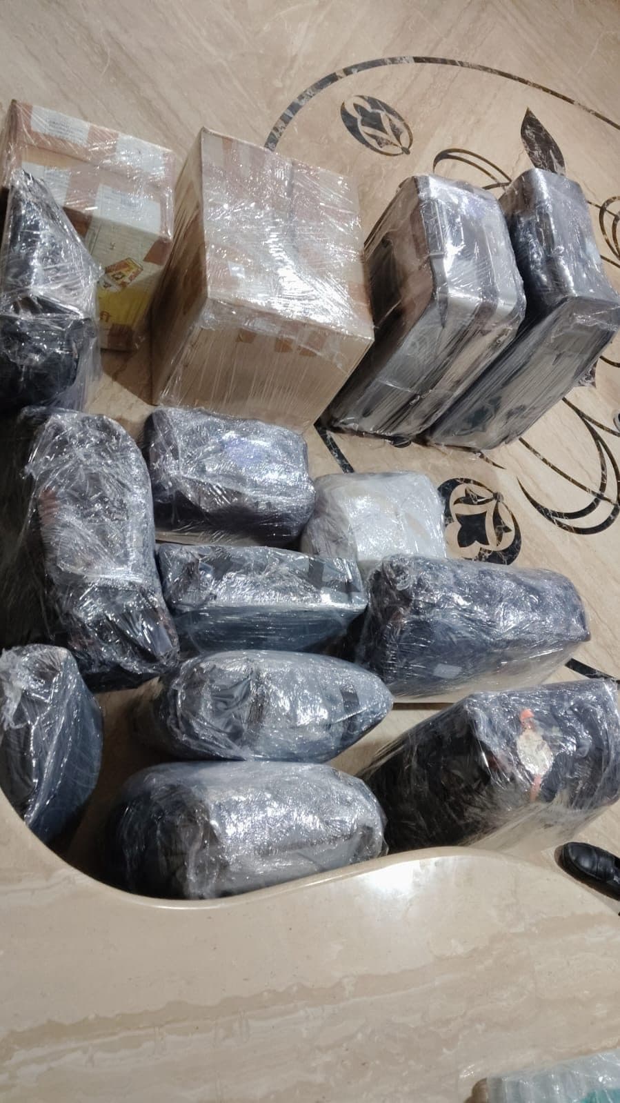 Cartons and wrapped goods packed and ready for loading