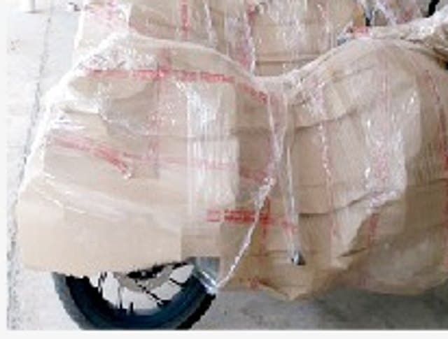 Two-wheeler wrapped and packed for transport by Sintex Relocation