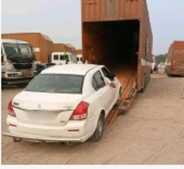 Car loaded into an enclosed carrier by Sintex Relocation