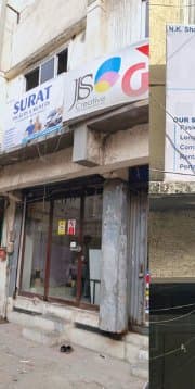 Surat Packers and Movers building entrance and parking area