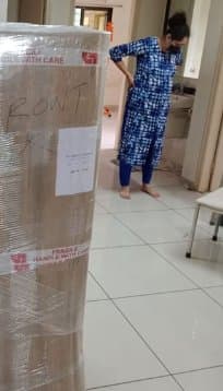 Furniture wrapped in stretch film and labelled for safe transit