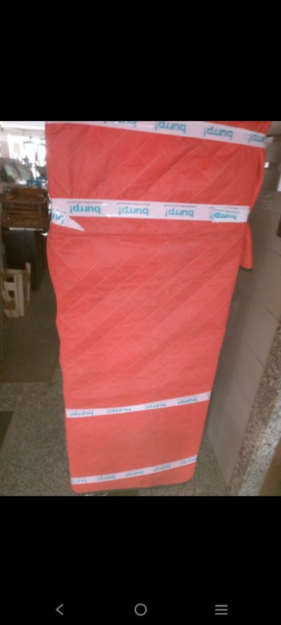 Furniture protected with quilted covers and packing tape