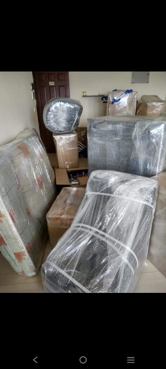 Furniture and mattress protected with bubble wrap and stretch film