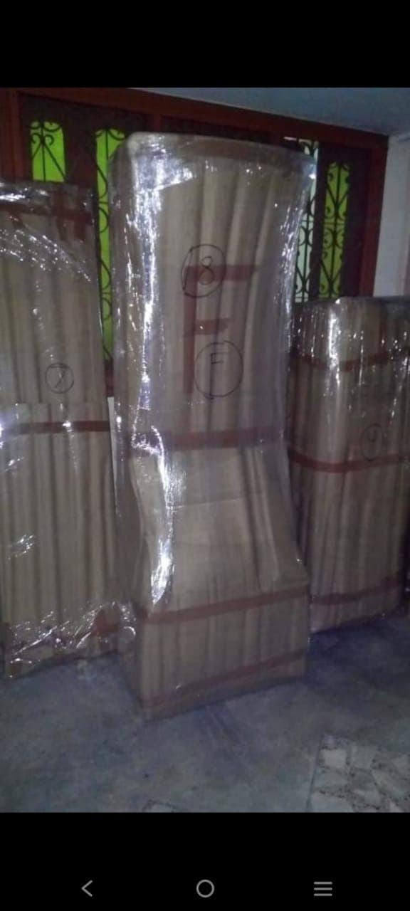 Numbered and wrapped furniture bundles ready for the truck