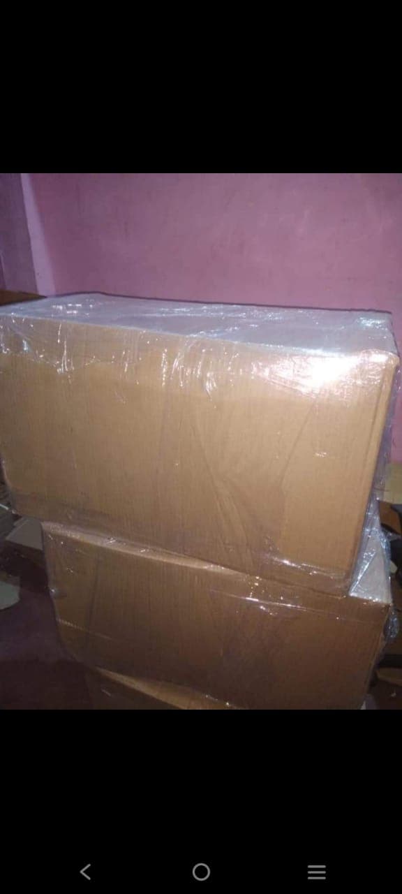 Cartons double wrapped in stretch film stacked for transit