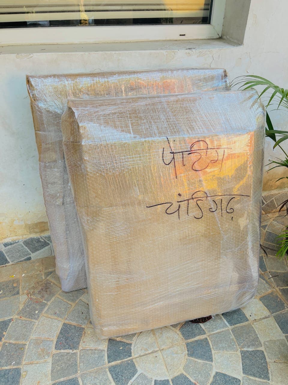 Two packed furniture panels ready for loading